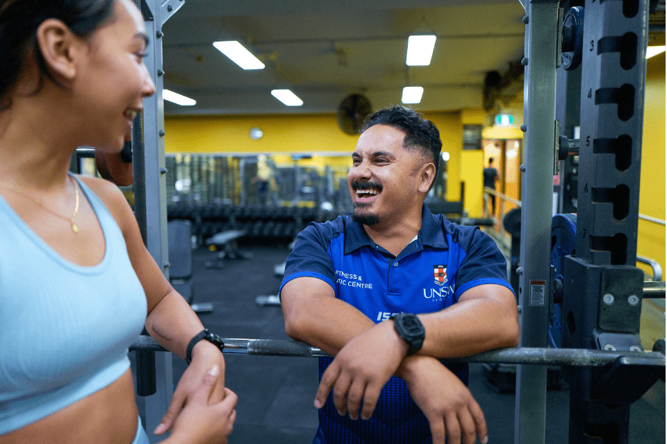 boy and girl chatting in gym